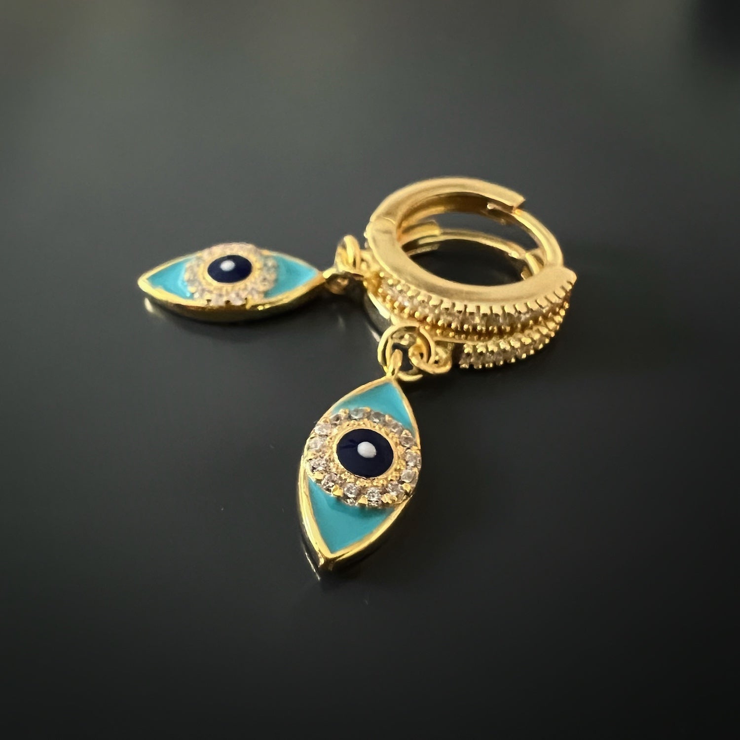 Eye-catching Turquoise Sparkly Gold Evil Eye Earrings with intricate details