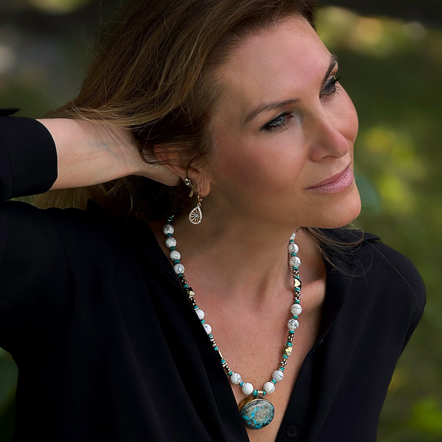 Timeless necklace with a striking turquoise gemstone pendant and white Howlite beads, symbolizing wisdom and serenity