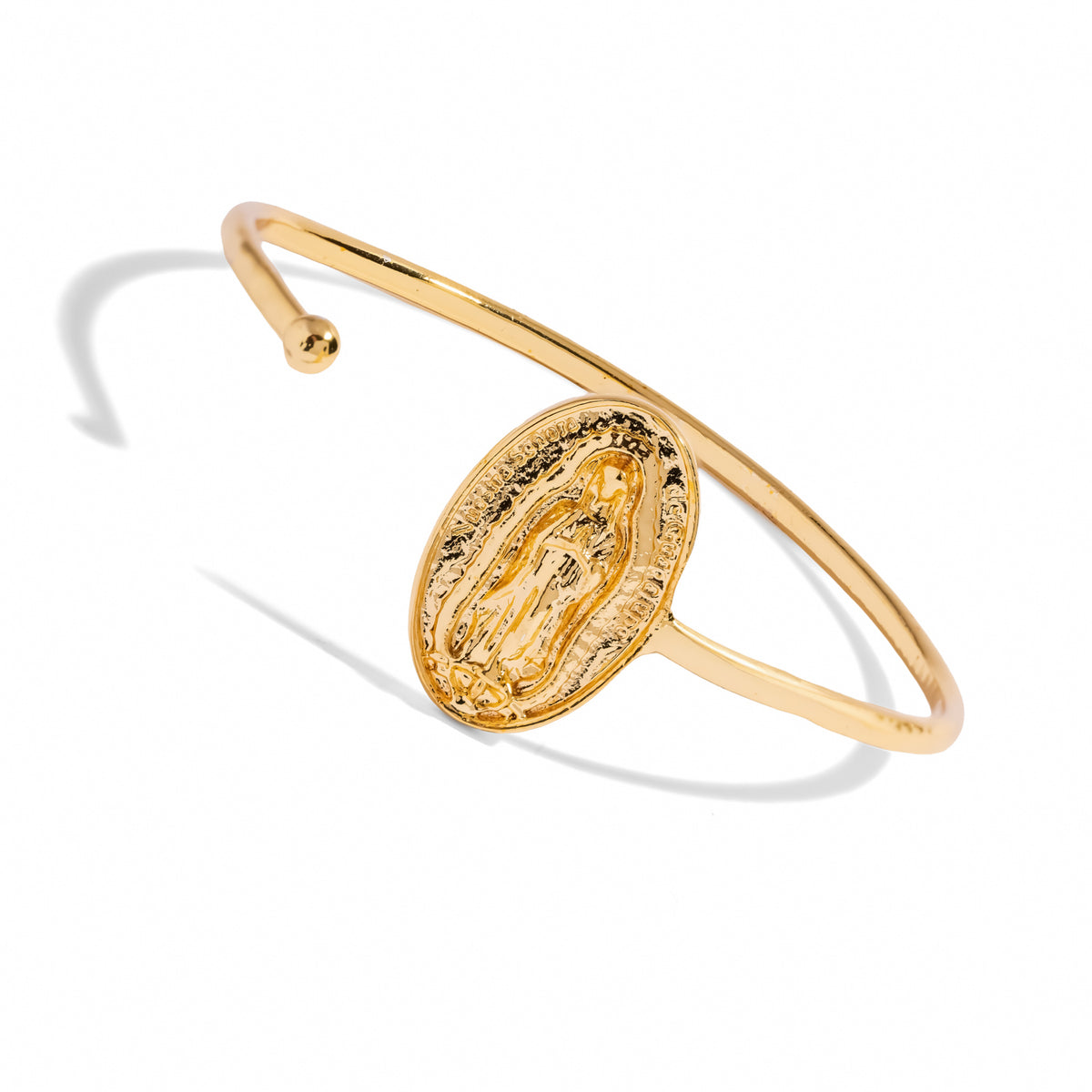 Angled view of the Virgin Mary medallion bangle showing the ball end of the open cuff
