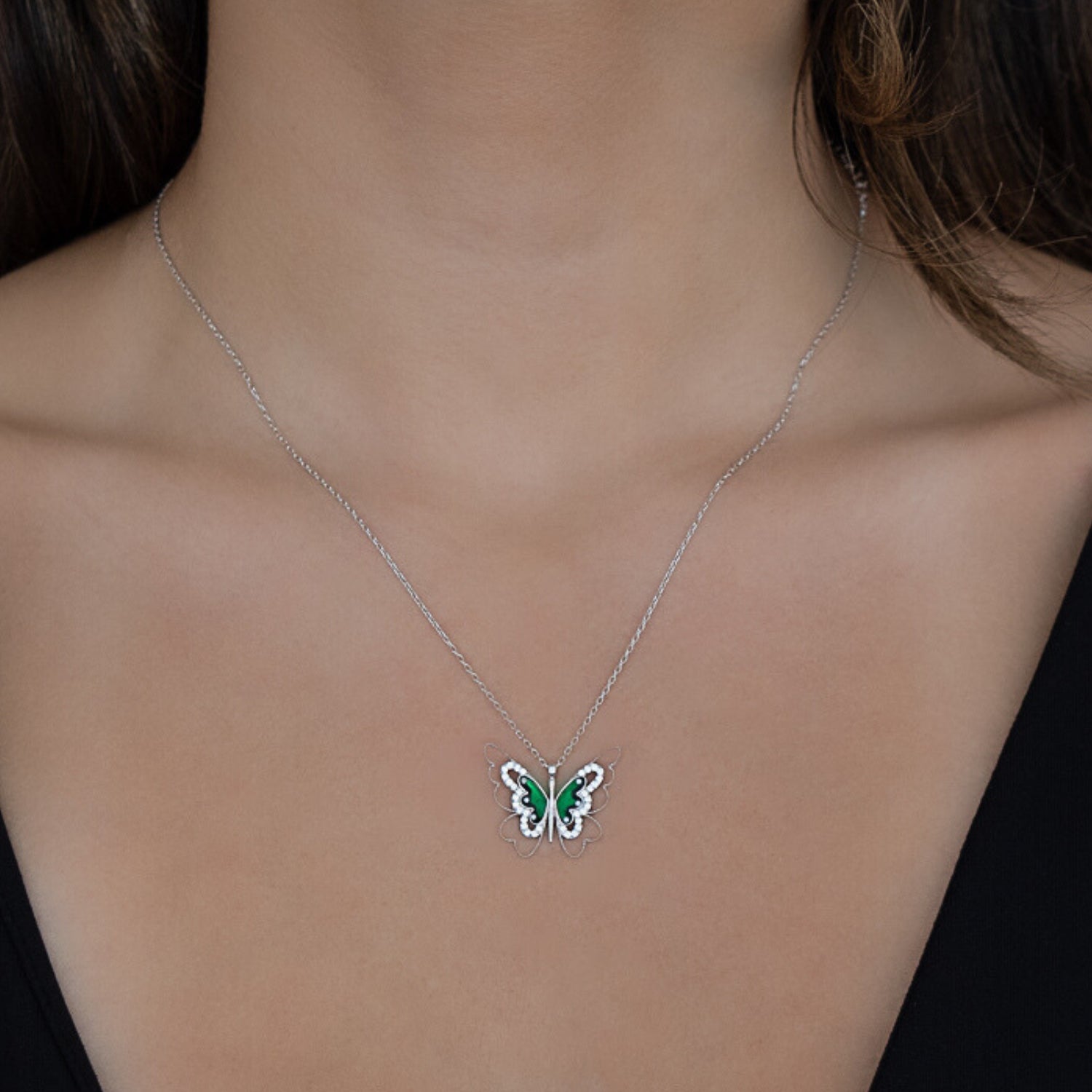 A model wearing the Abundance Green Butterfly Necklace, radiating elegance and transformation.
