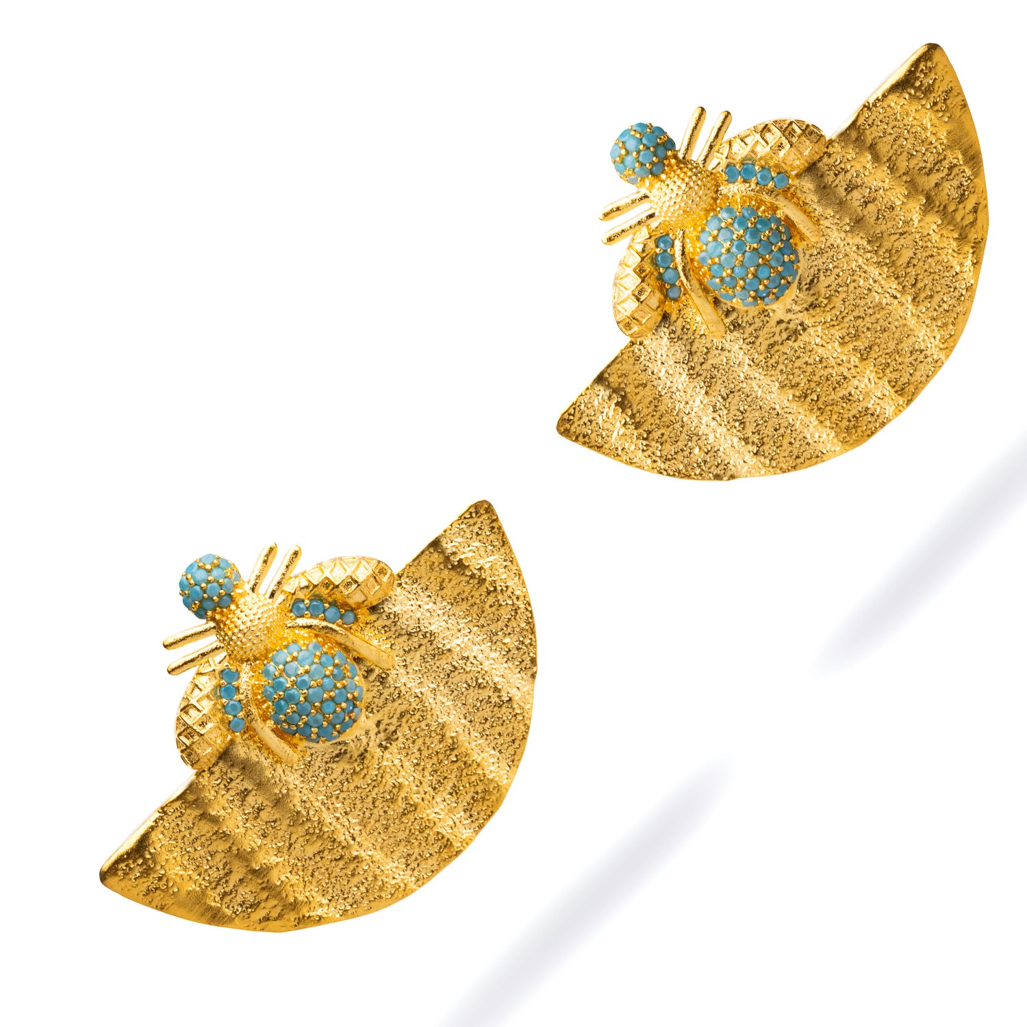 Unique chunky earrings with a gold half-moon design, adorned with turquoise stones and a honey bee detail, perfect for making a bold statement.
