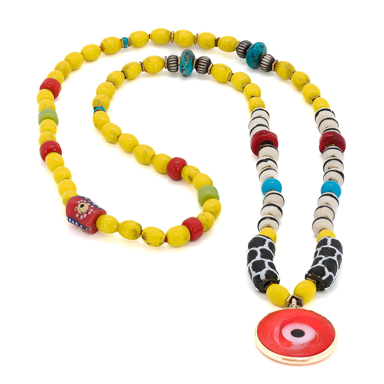 Detailed shot of the handmade ceramic black and white beads used in the African Yellow Happiness Necklace.