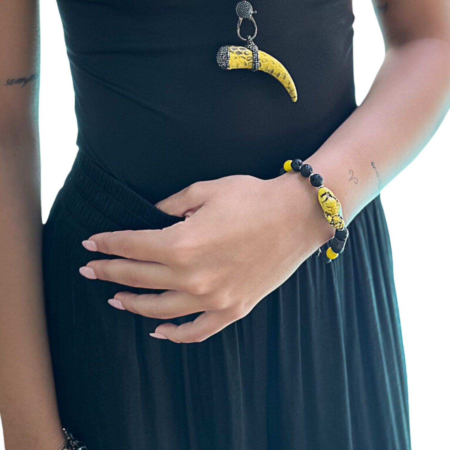 Model wearing the African Yellow Turquoise Bracelet, showcasing its vibrant colors and complementing their style.