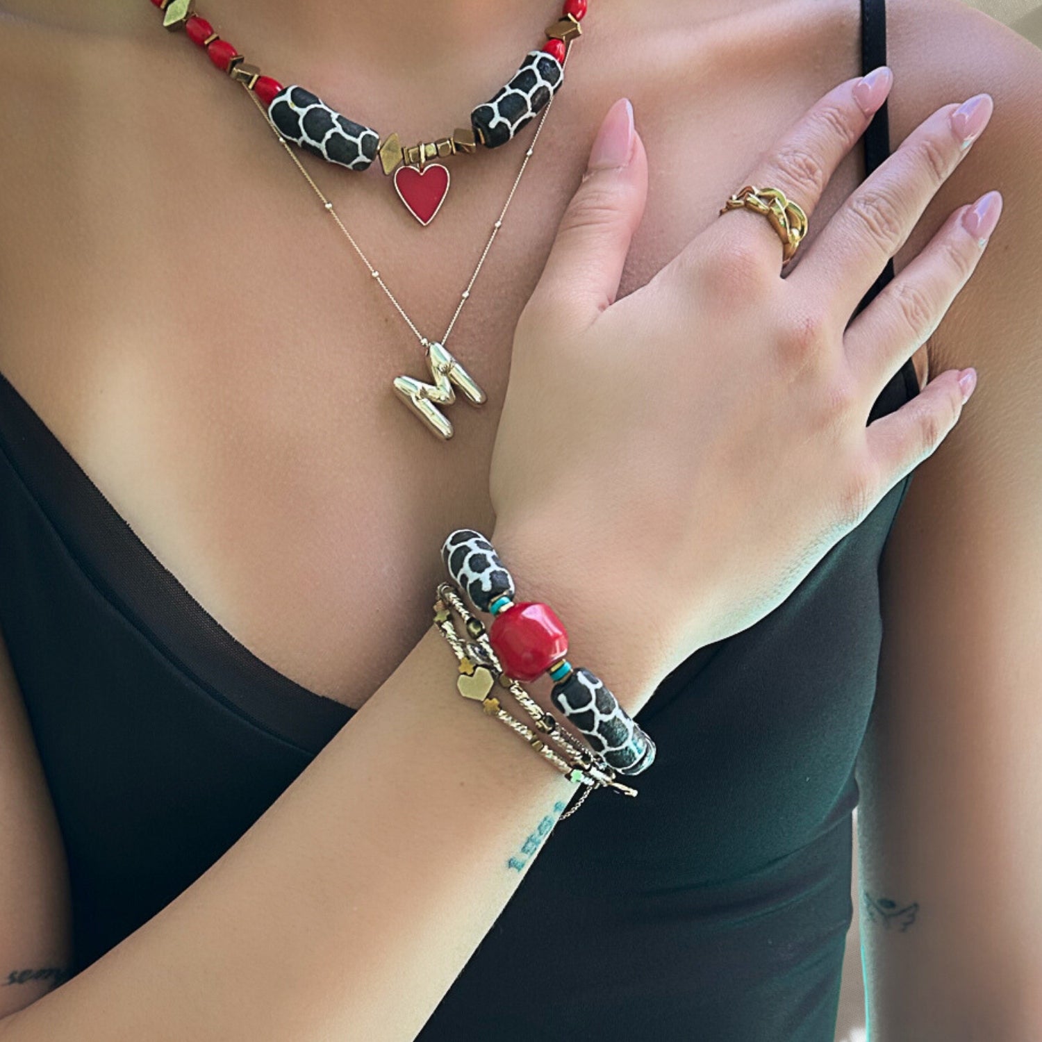 Model wearing the African Zebra Red Bracelet, showcasing its striking design and vibrant colors.