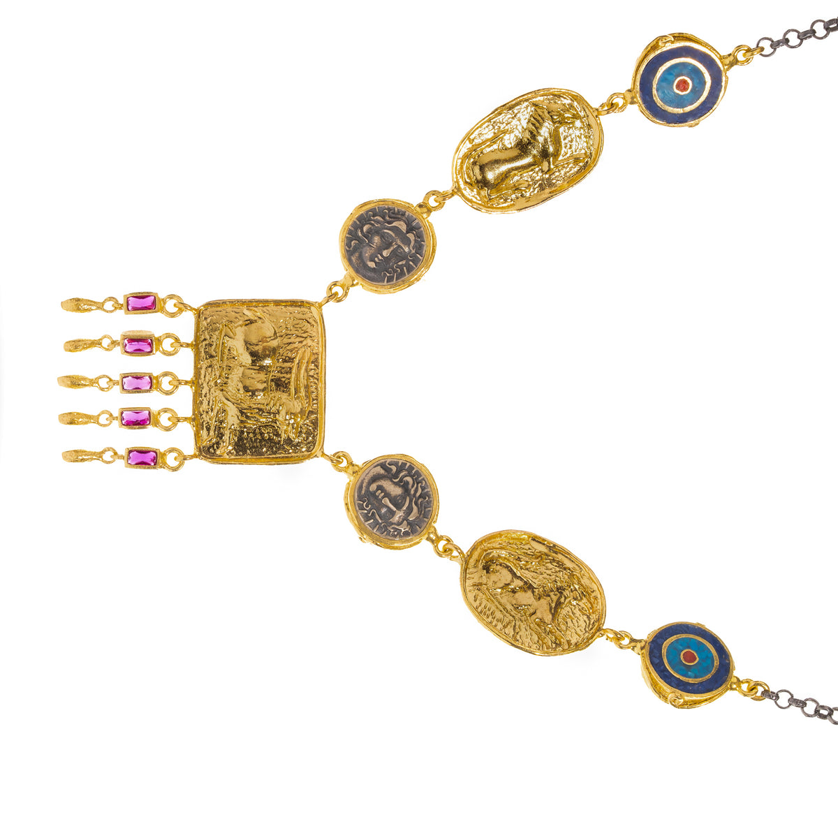 Detail of the Amulet Gathering necklace laid at an angle, central gold plaque with five ruby baguette drops