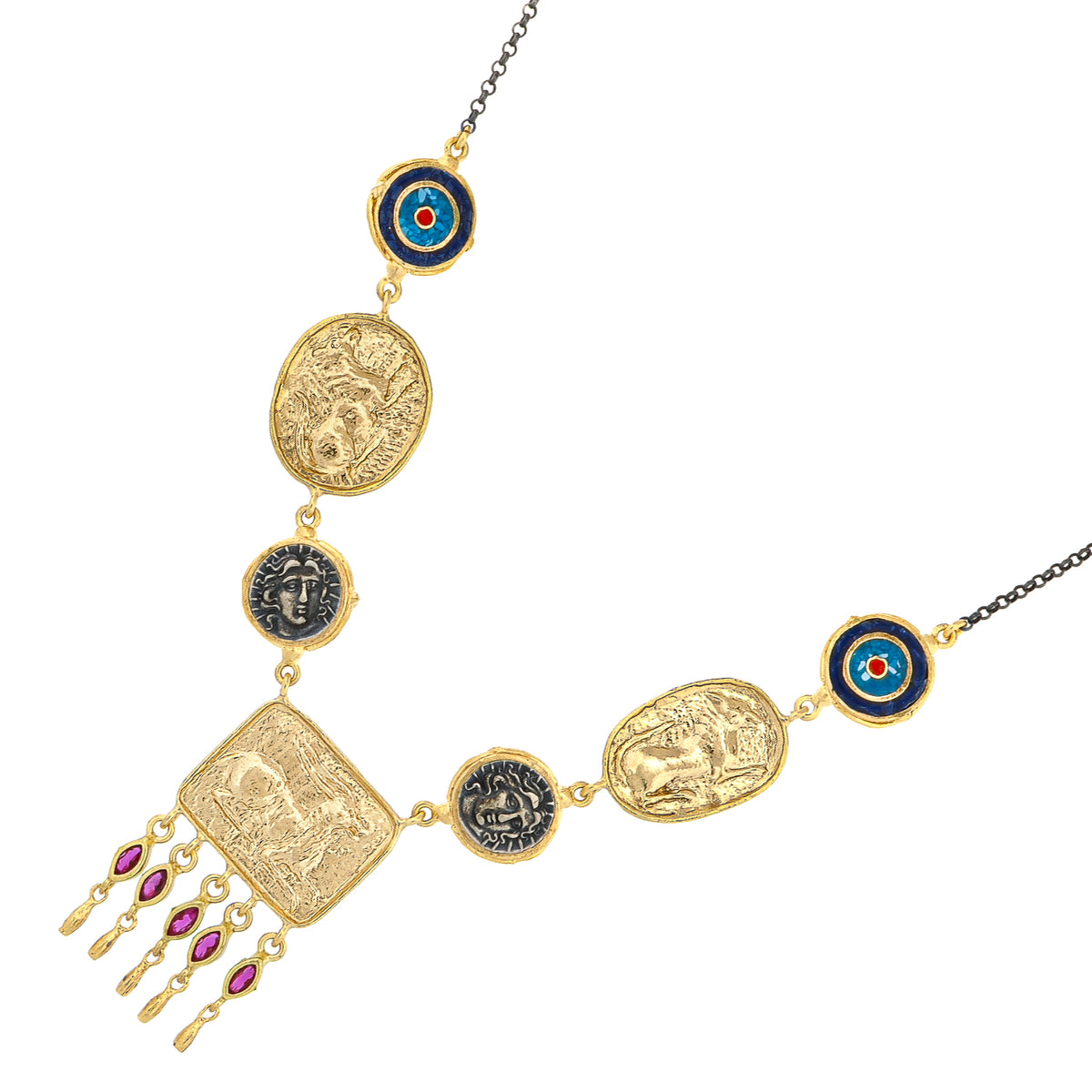 Detail of the Amulet Gathering necklace laid at an angle, central gold plaque with five ruby baguette drops