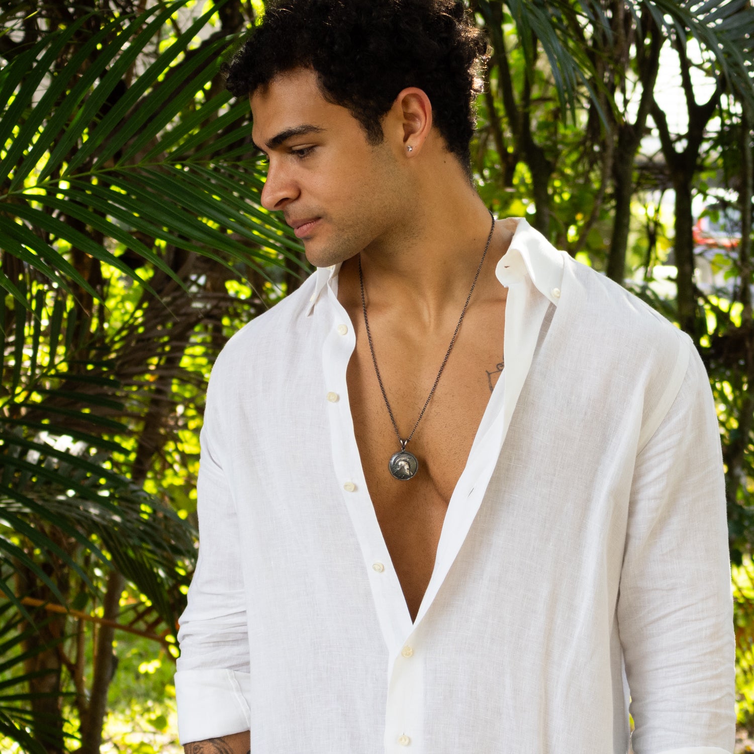 Sterling silver necklace with ancient warrior helmet medallion pendant, rhodium finish, antique texture, strong chain, bold masculine style.