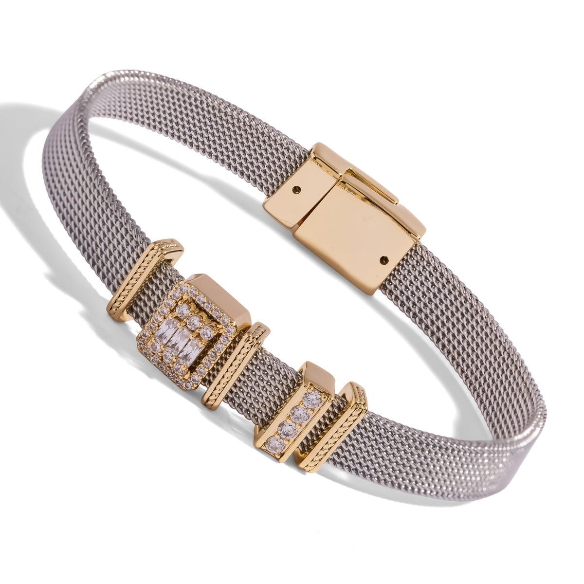 Angled view of the baguette diamond halo charm bracelet showing the gold plated magnetic clasp