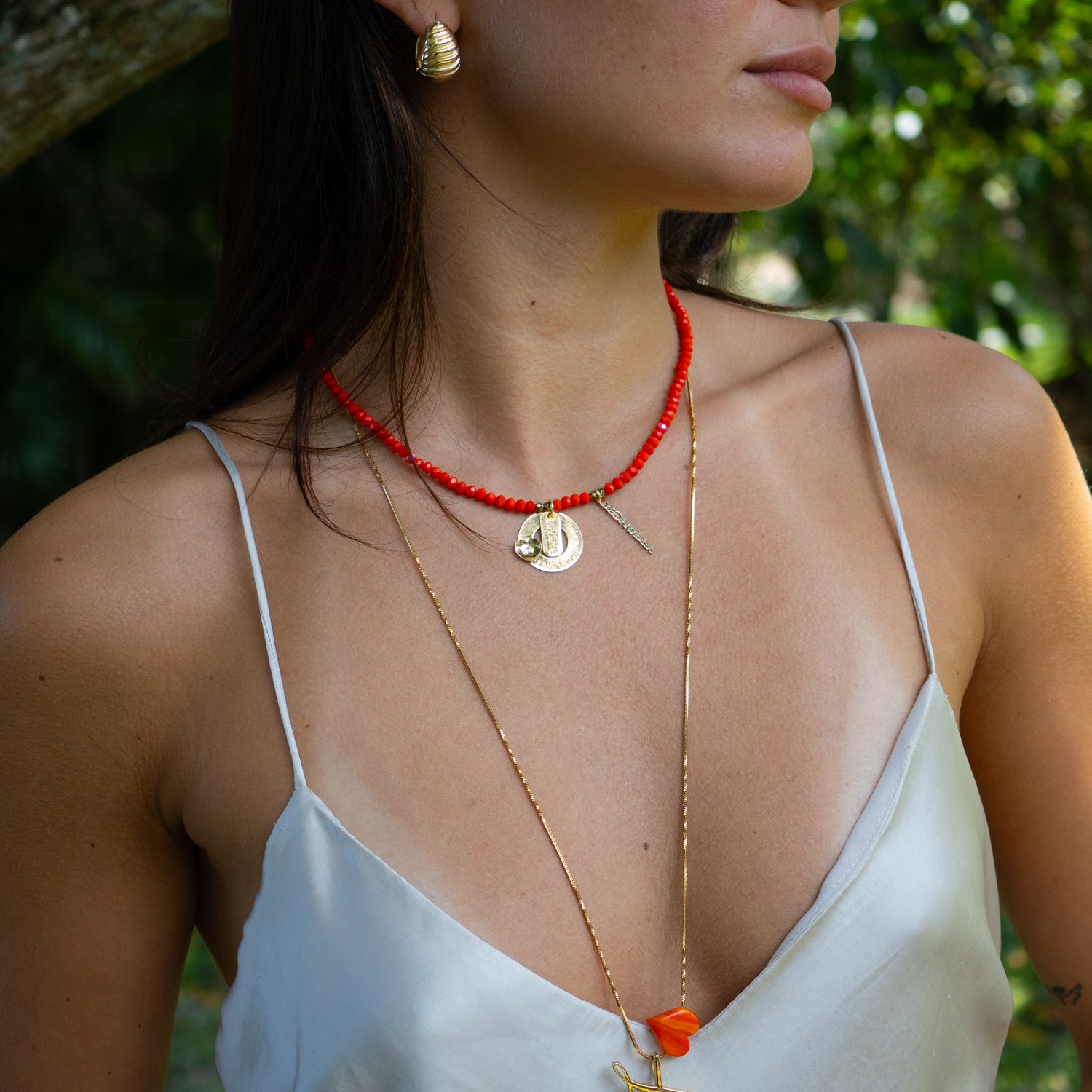 15-inch red beaded choker necklace with gold-plated affirmations and crystal sparkle.

