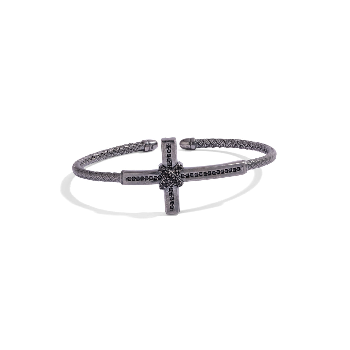 Front view of the woven oxidized silver cuff bracelet with a black zircon cross on a white background