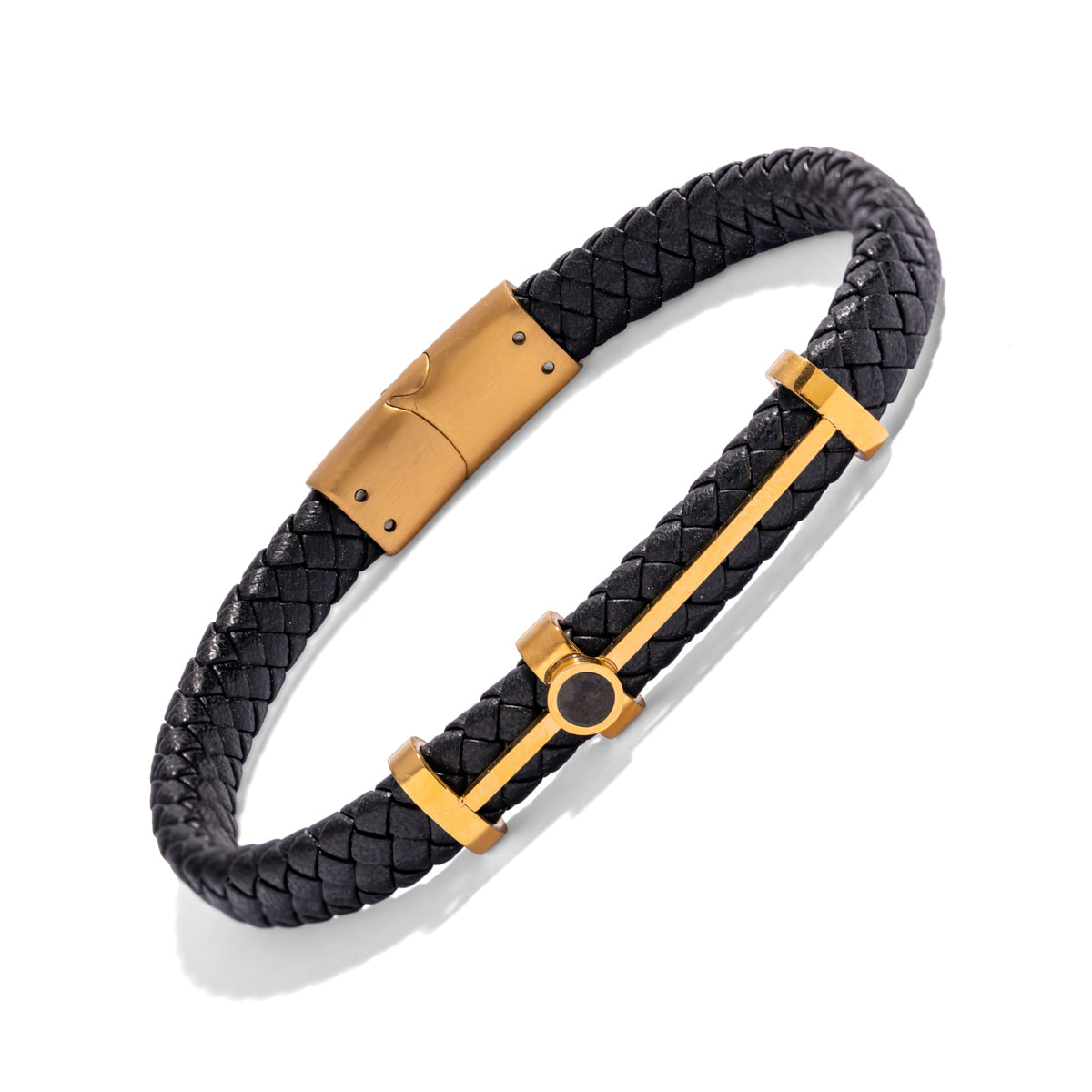 Black braided leather bracelet with a gold bar and three keepers, seen from above on a white background