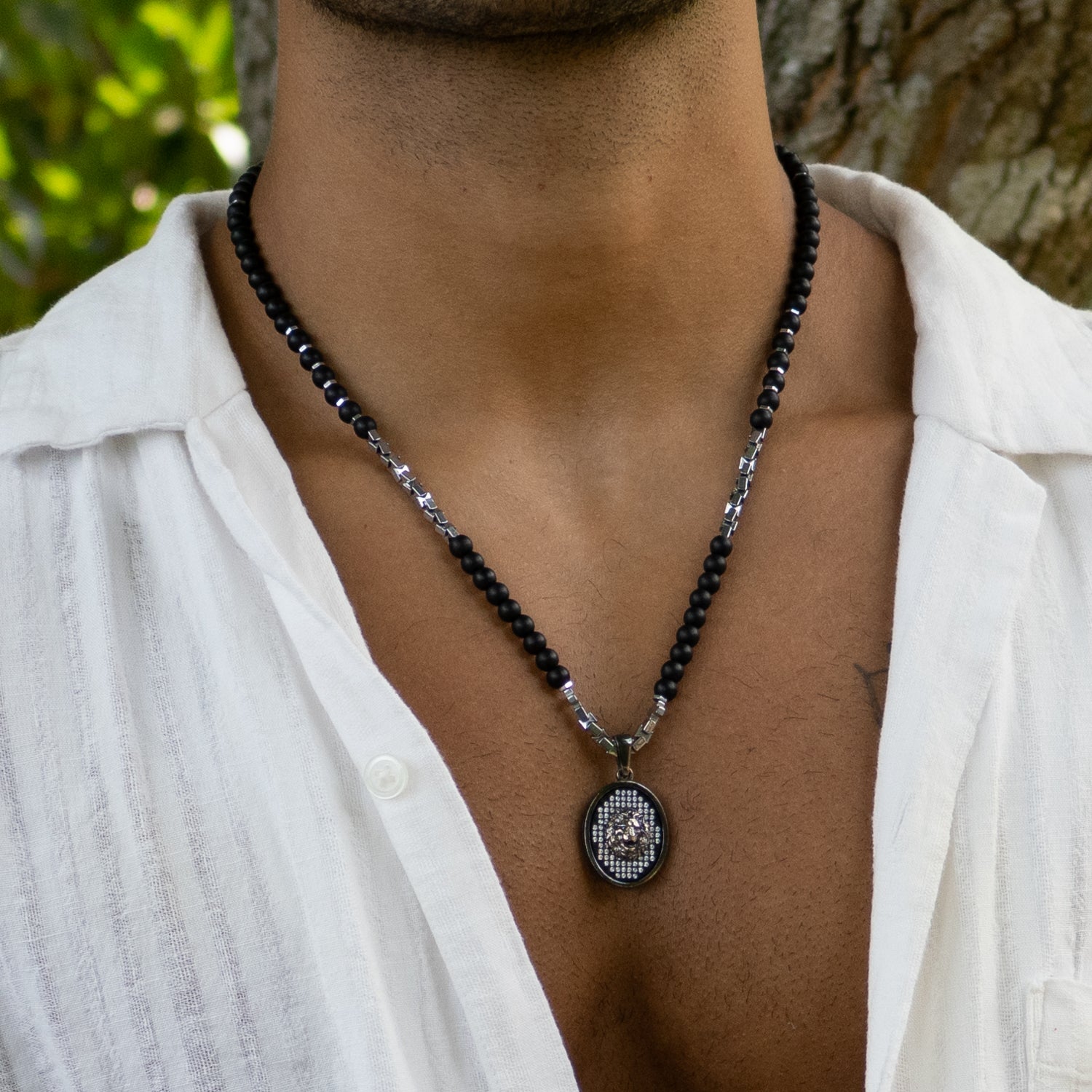 Black onyx beaded men's necklace with handcrafted 925 silver lion pendant and Swarovski crystals.

