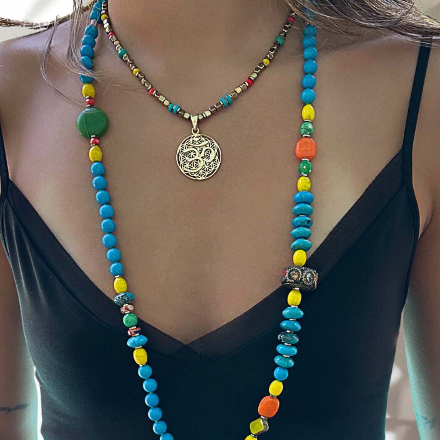 Model wearing the Breathe Om Gold Necklace, radiating serenity and embracing the spiritual connection it represents.