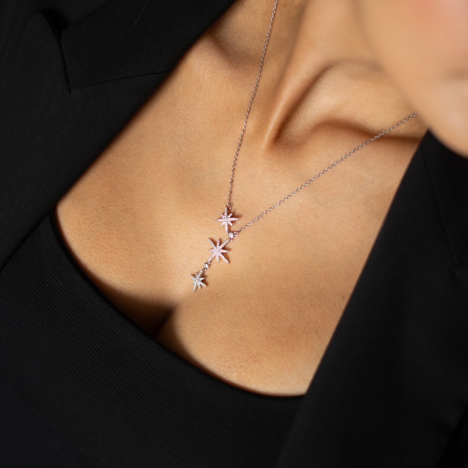 Celestial-inspired silver necklace with cubic zirconia star pendants