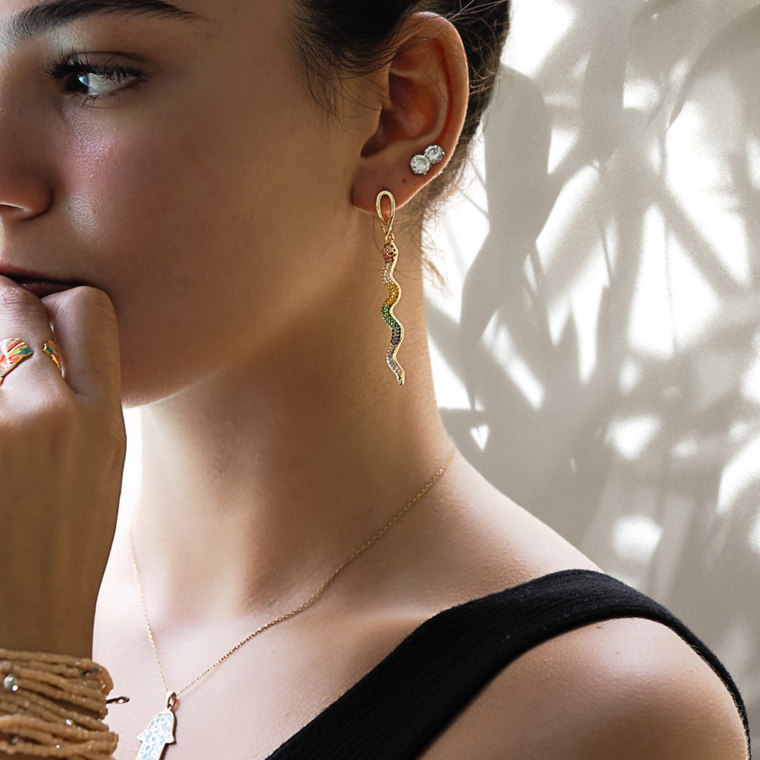 Model wearing the Cheerful Snake Earrings, highlighting their versatility and stylish look.