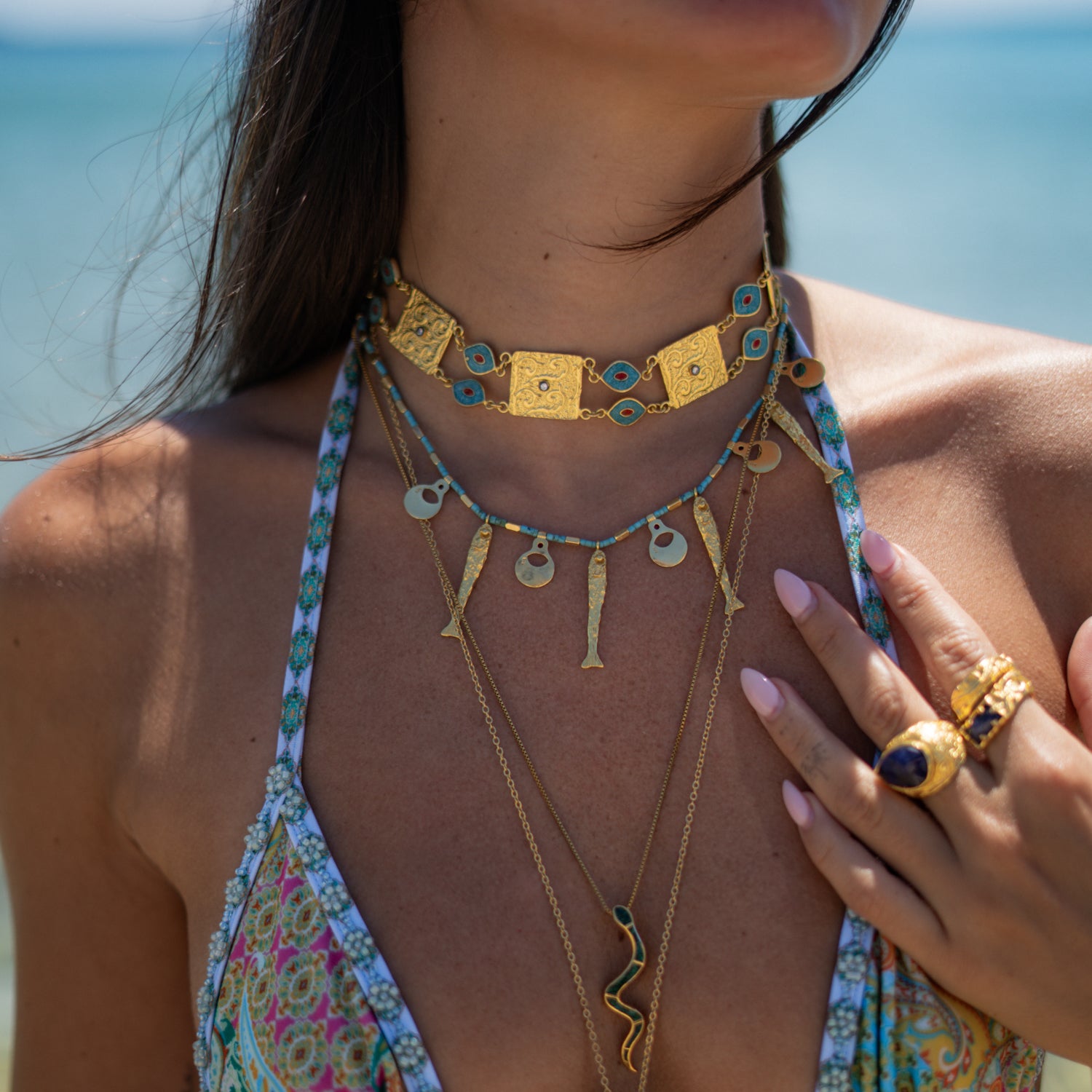 Cleopatra Evil Eye Turquoise & Coral Engraved Gold Collar Necklace worn high on the neck, layered with longer gold chains