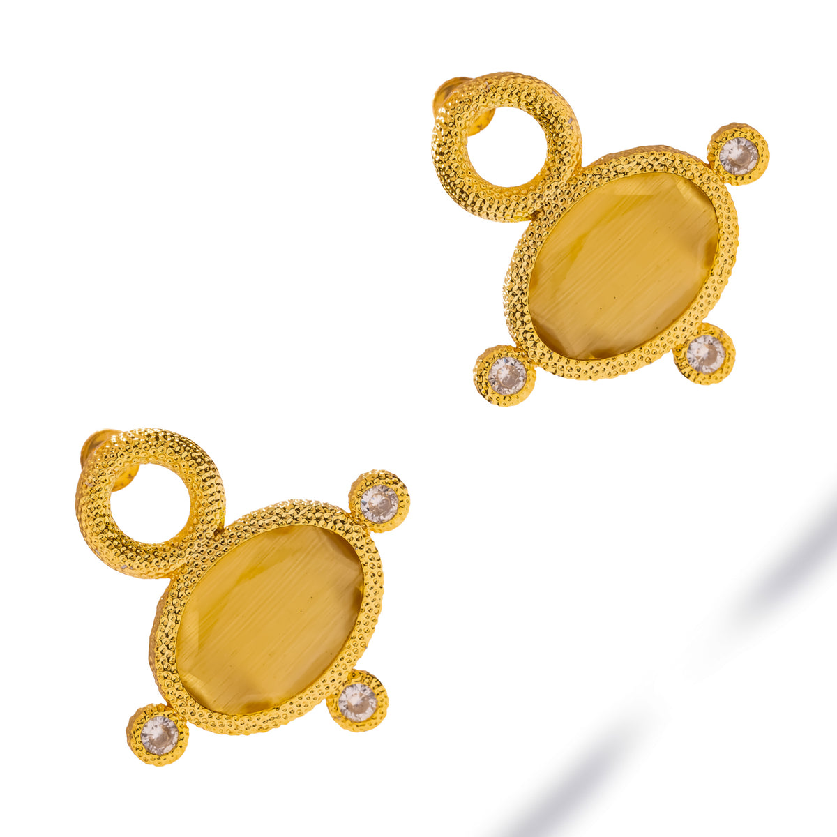 Pair of Cleopatra Golden Citrine Cat Eye earrings at an angle, beaded gold frames and three clear zircon accents