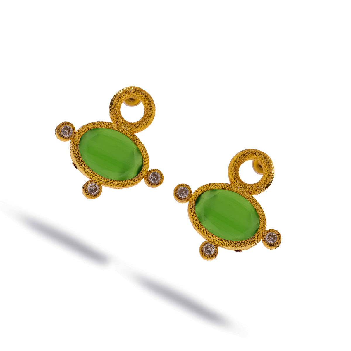 Pair of Cleopatra Green Cat Eye Gold Statement Stud Earrings at an angle, showing the textured gold bezel