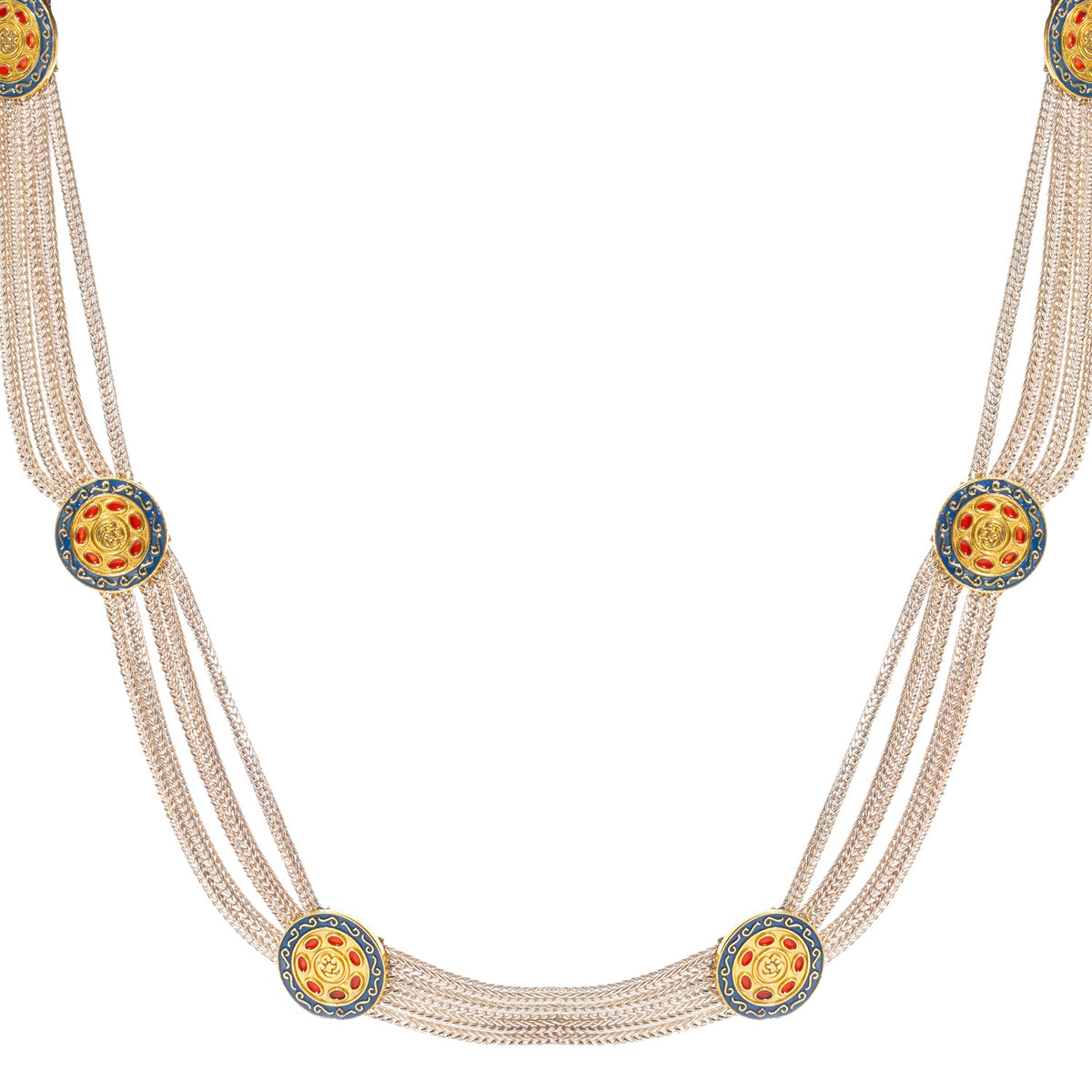 Close view of the Cleopatra Mystic medallions: deep blue ring, gold scrollwork and red ovals around a gold center