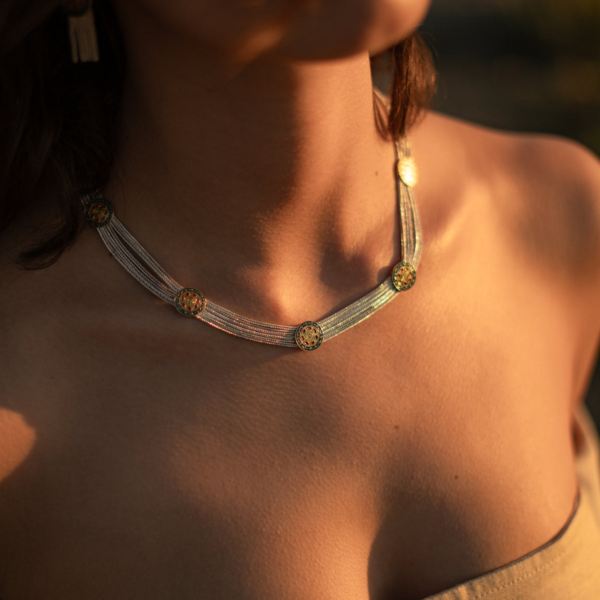 Cleopatra Mystic Vintage Style Two Tone Statement Necklace worn at the collarbone in warm evening light