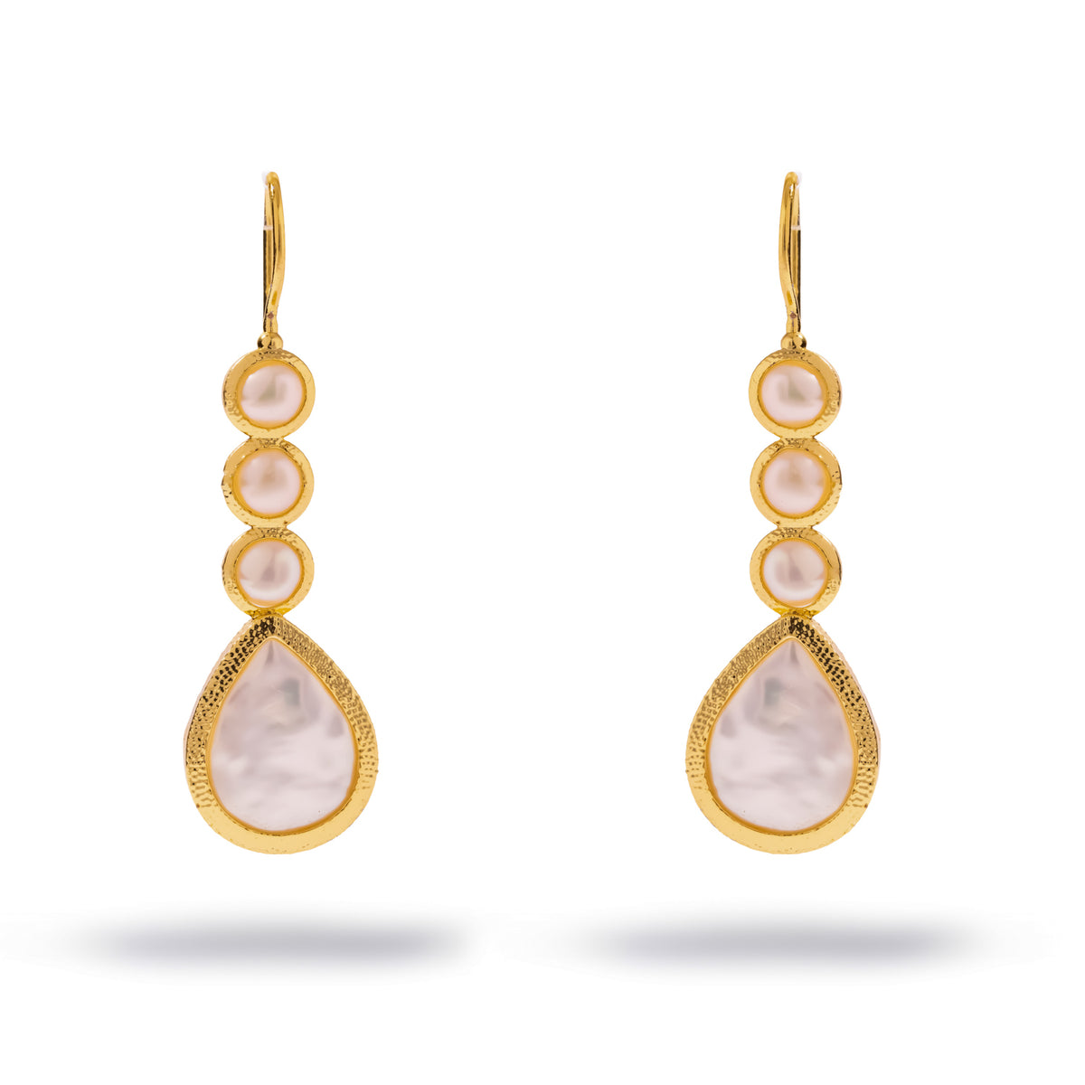 Pair of Cleopatra pearl cascade gold drop earrings on white, three round pearls above a teardrop pearl in textured gold frames