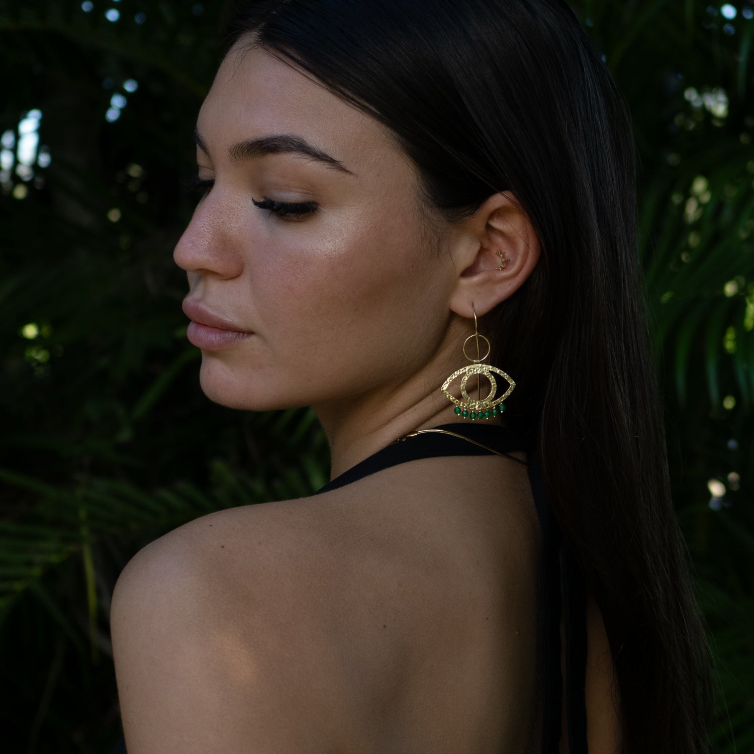 Handcrafted 925 sterling silver earrings plated with 18k gold, featuring green jade stones and Cleopatra-inspired eye motif