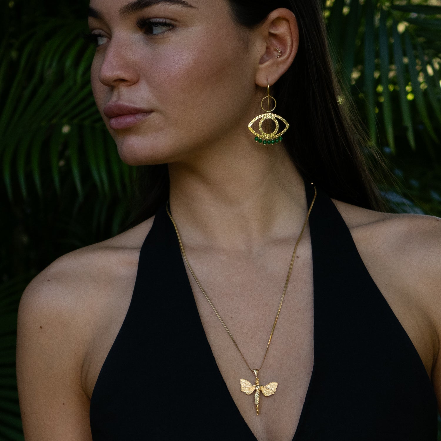 Handcrafted 925 sterling silver earrings plated with 18k gold, featuring green jade drops and Cleopatra-inspired eye design.