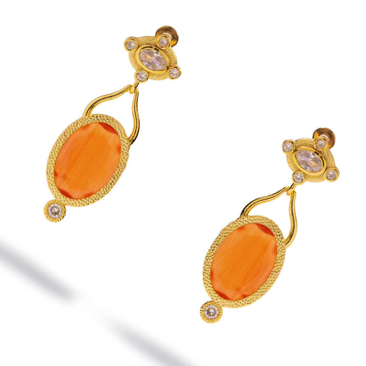Pair of Cleopatra Sunset Cat Eye Gold Drop Earrings at an angle, curved gold bails and a zircon below each stone