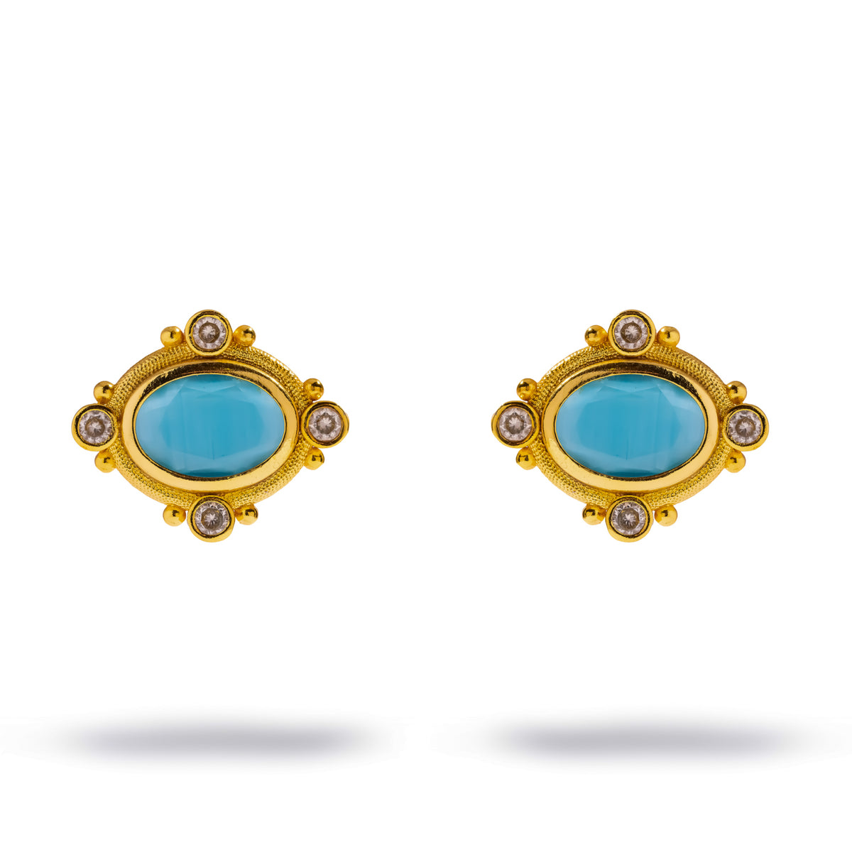 Cleopatra Turquoise Cat Eye Gold Statement Stud Earrings on white, oval turquoise stones framed by clear accents and gold beads