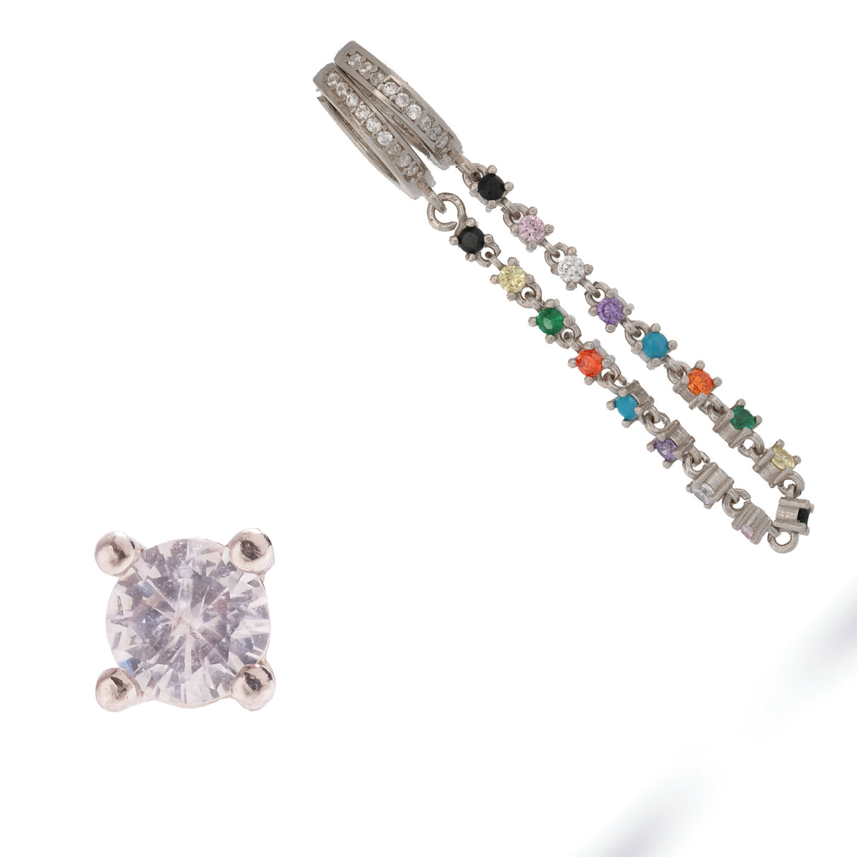 Color Story sterling silver earrings laid on white, prong set black, lilac, green, orange and turquoise stones