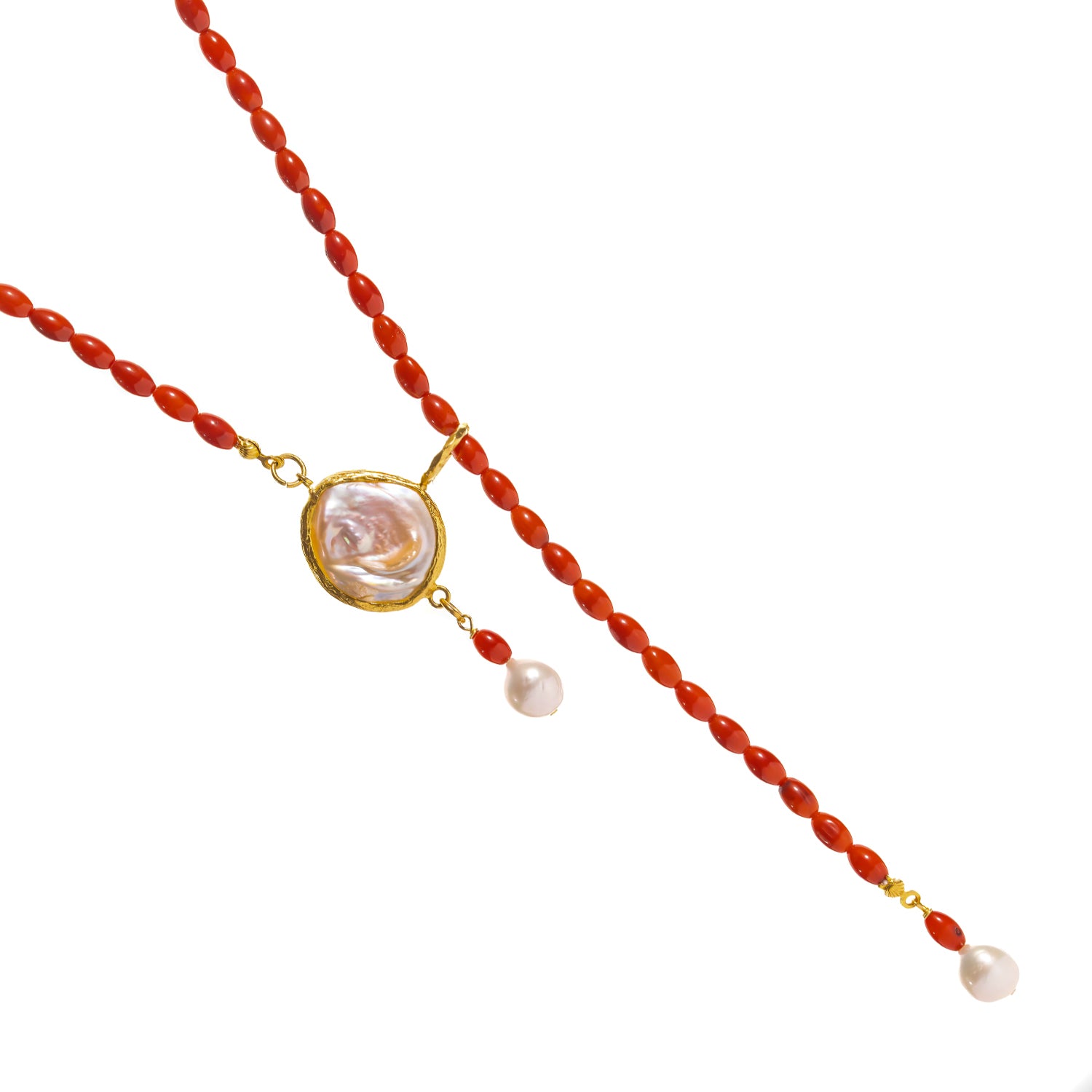 Close-up of the 18K gold plated baroque pearl centerpiece on the one of a kind coral beaded adjustable necklace