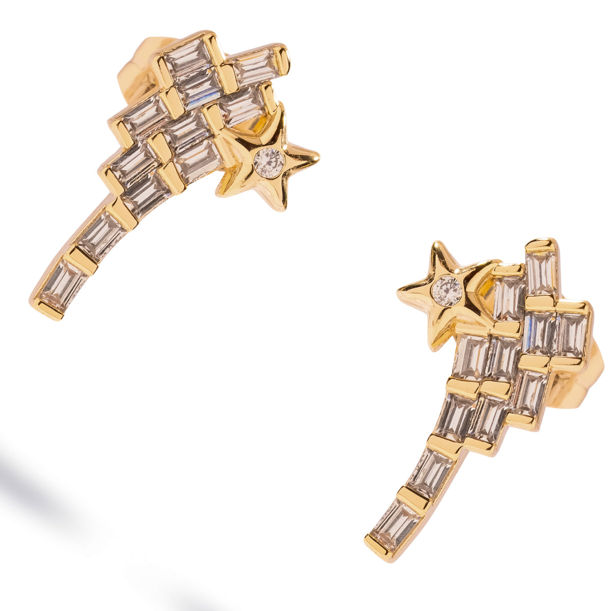 Angled studio view of the shooting star stud earrings showing the channel set baguette stones, the gold star and the tapering tail