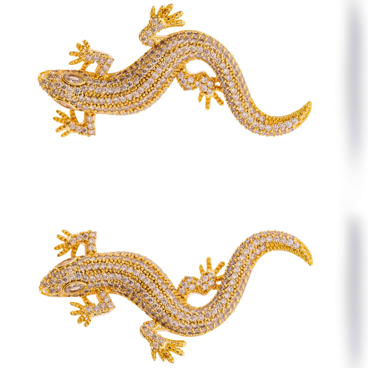 Crocodile Pave Zircon Gold Statement Earrings shown horizontally, sculpted feet, scales and sweeping tail in pave zircon