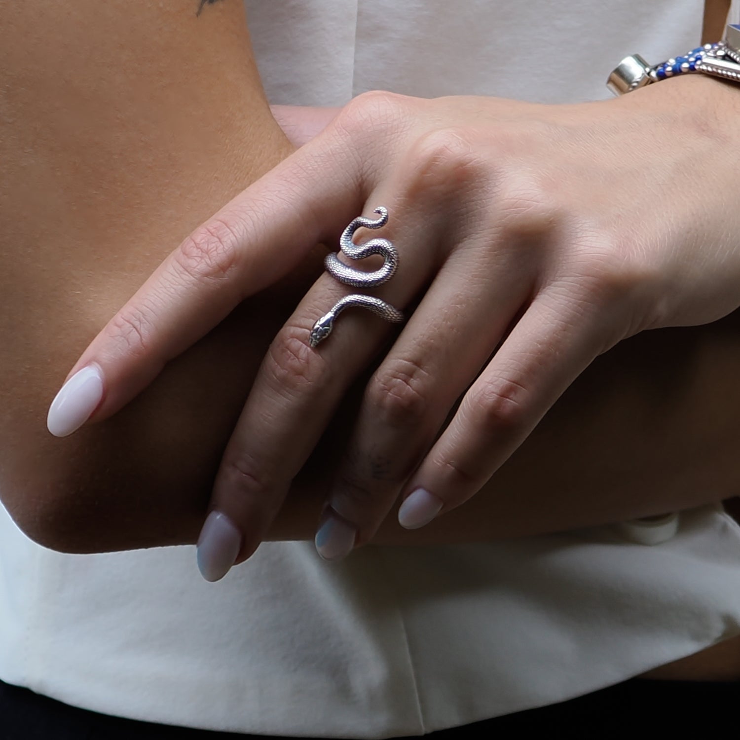 Cycle of Life Snake Ring with a sterling silver construction and elegant serpent motif, symbolizing rebirth.
