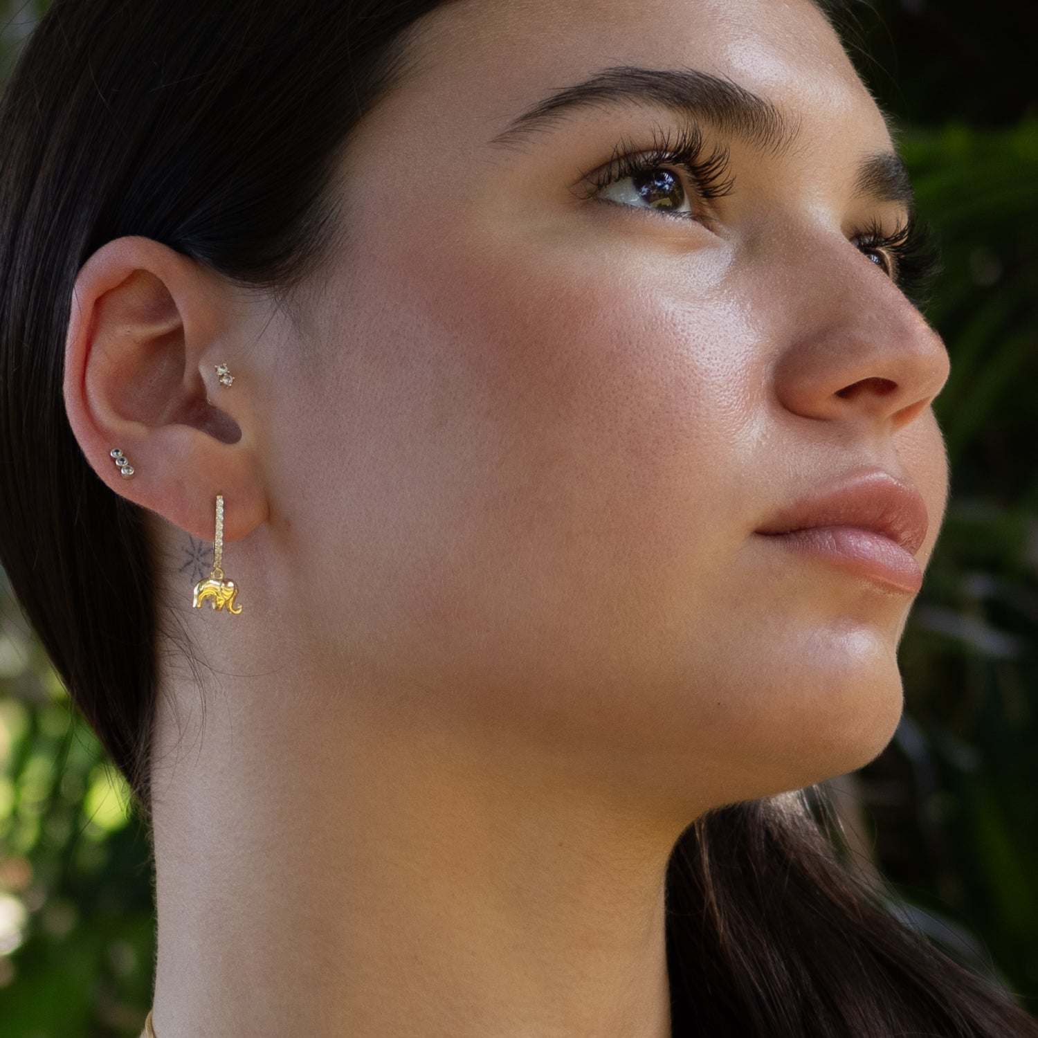 14K gold-plated sterling silver huggie earrings featuring sparkling elephant charms


