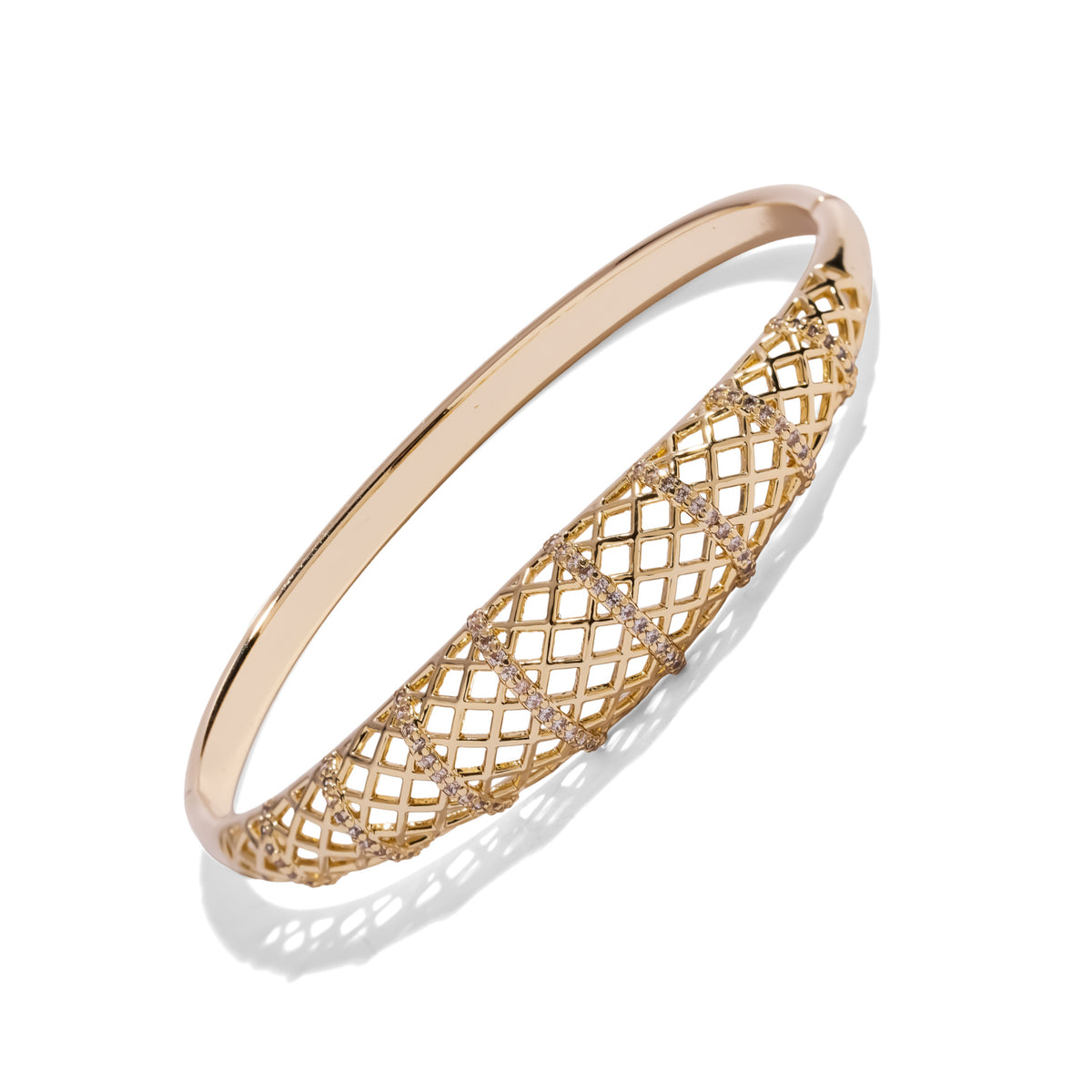 Openwork lattice gold bangle with white zircon accents, side view on a white background