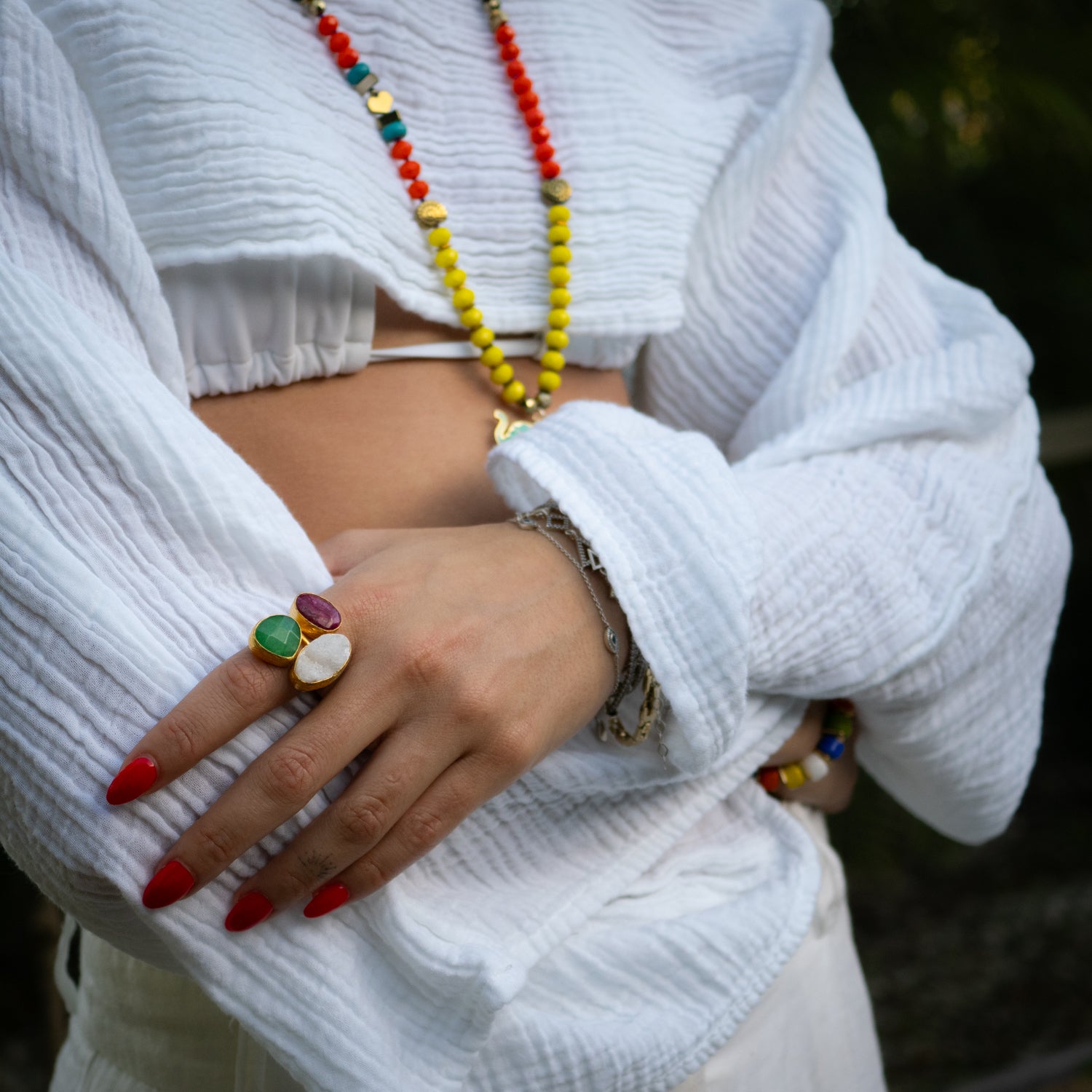 Artisan-crafted spiritual ring with shimmering quartz, healing emerald, and fiery ruby

