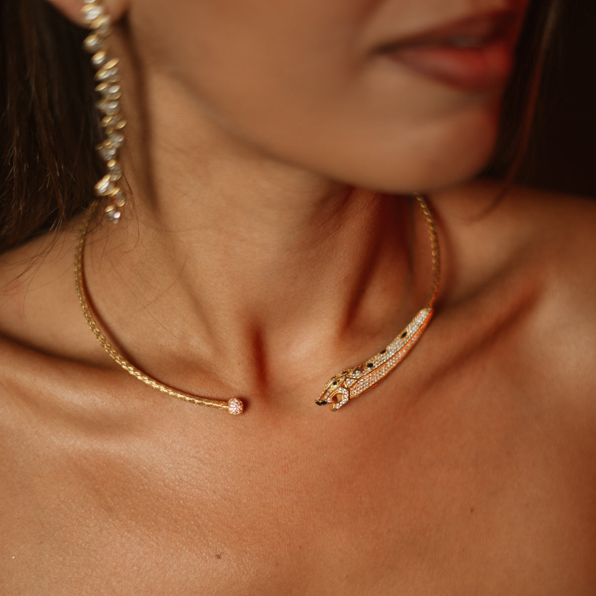 Gold vermeil panther collar necklace sitting close at the throat on bare skin