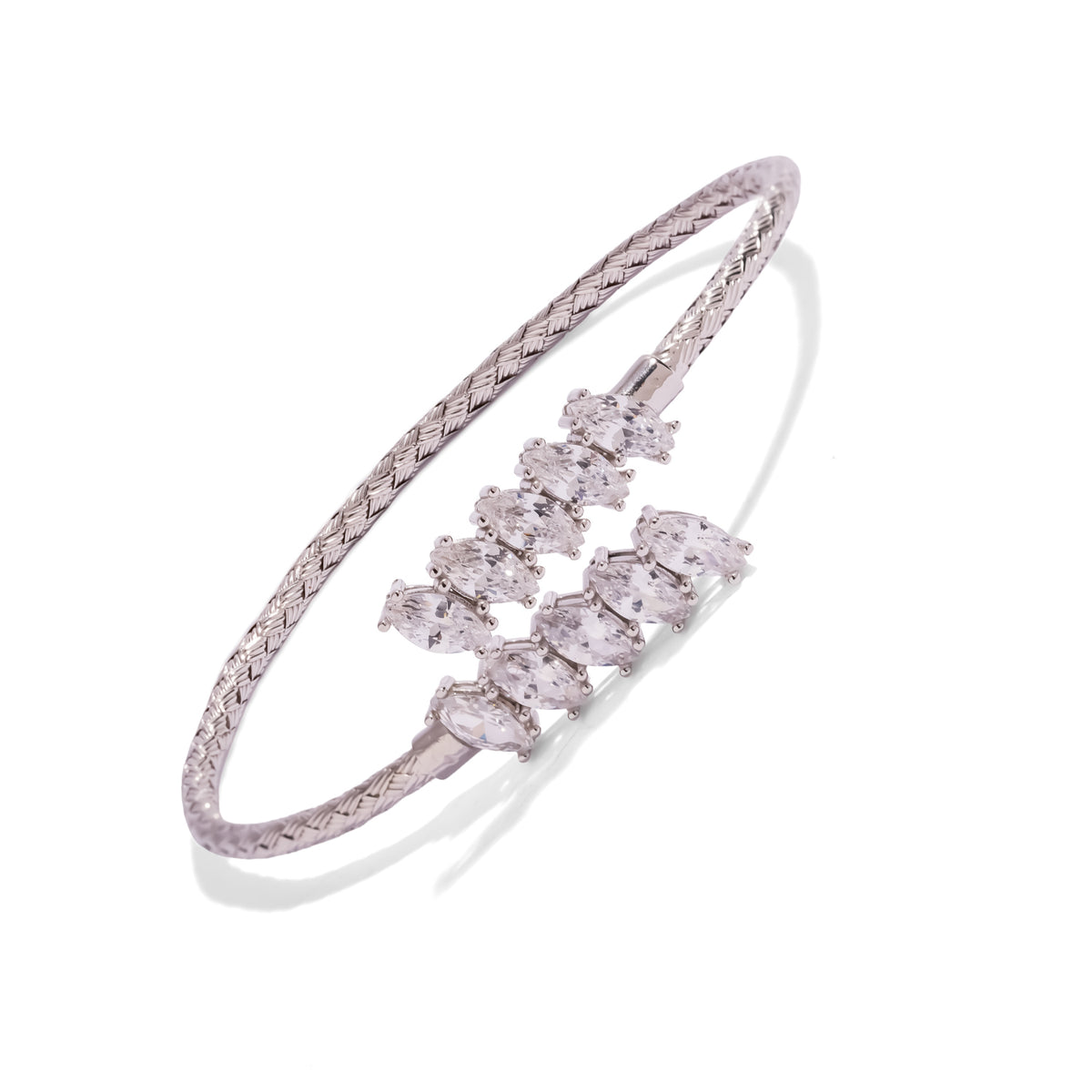 Top view of the marquise diamond bypass cuff showing the overlapping ends and woven silver band