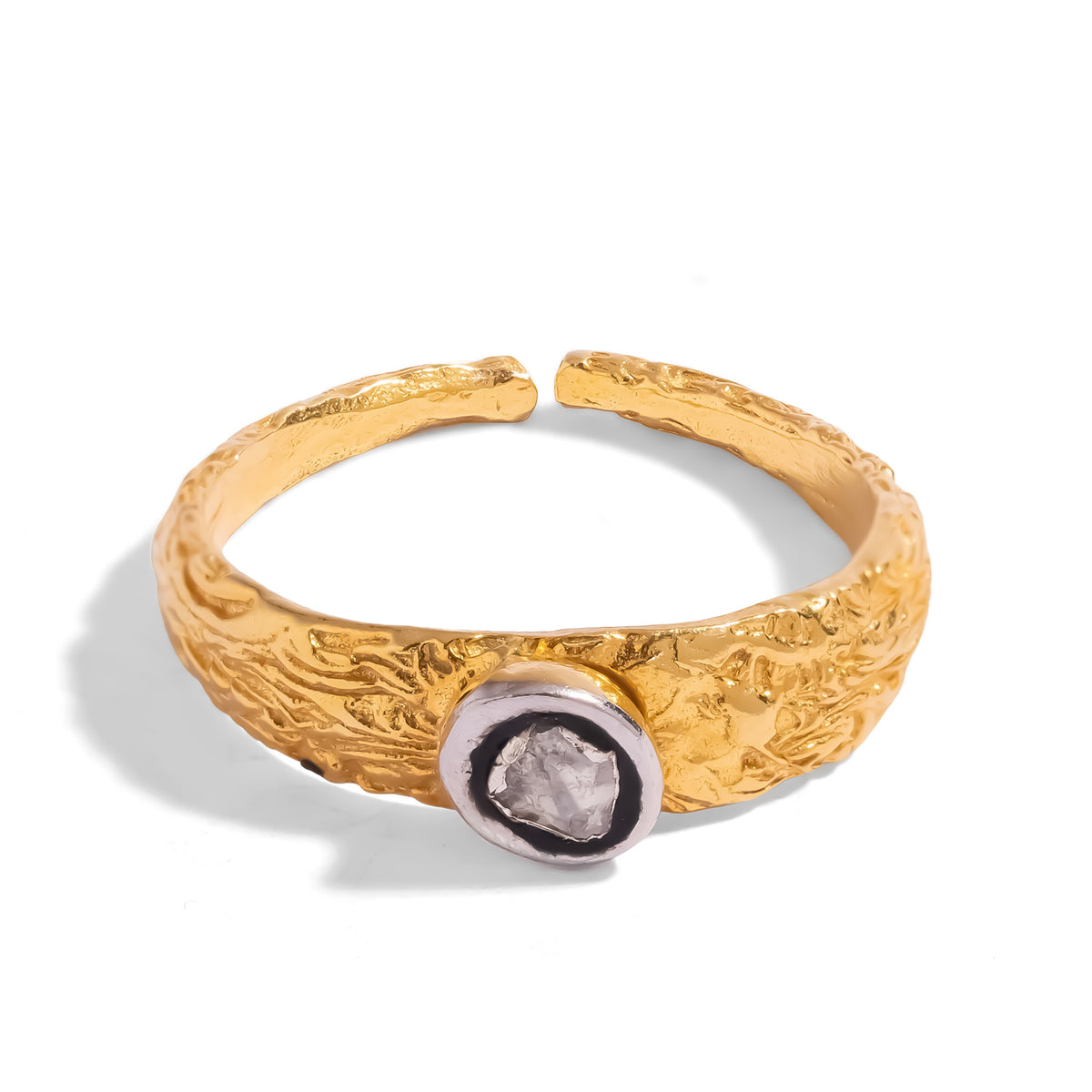 Angled view of the two tone band ring showing the open adjustable back and the hand textured bark finish gold band