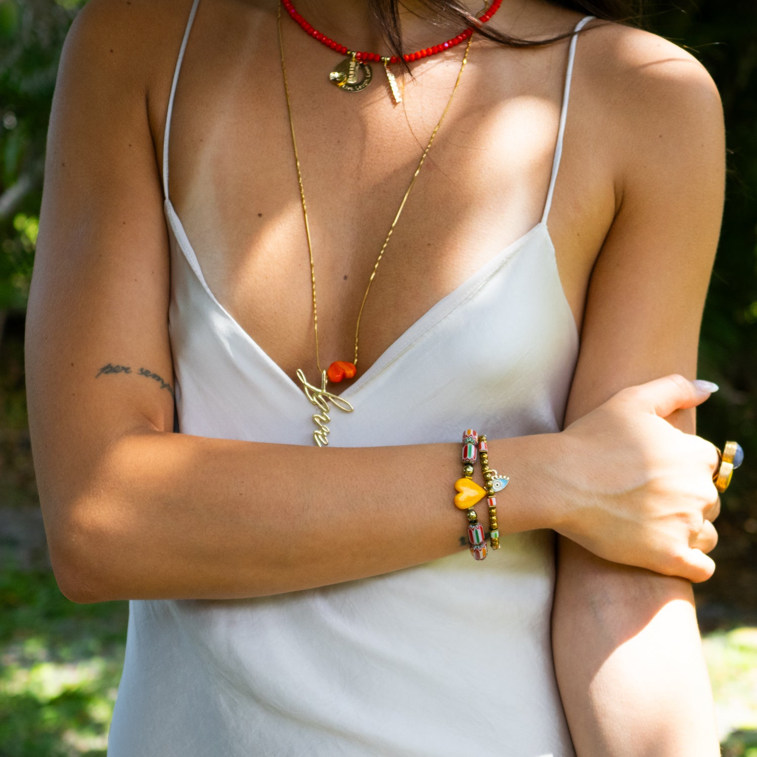 Handmade duo with gold hematite stones and vibrant love-inspired ceramic beads.

