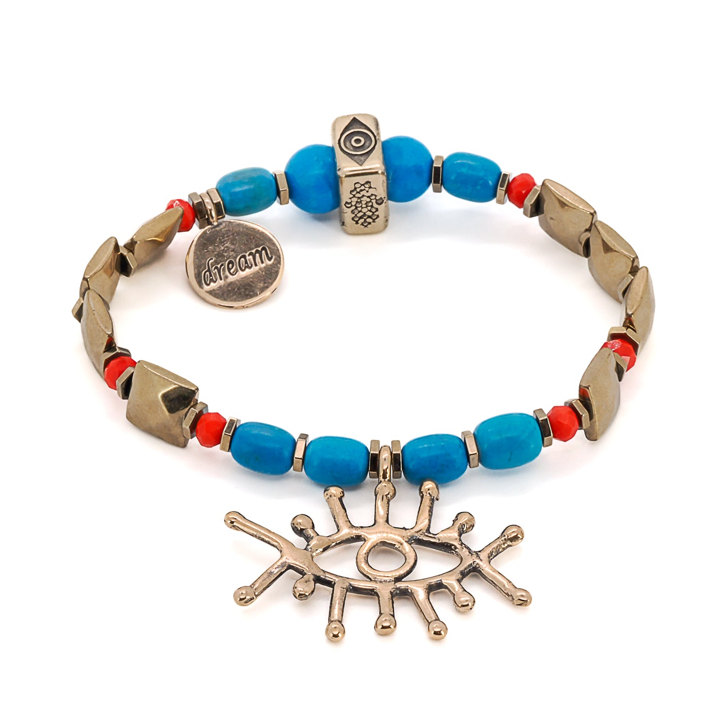 A close-up of the Evil Eye Dream Bracelet, featuring turquoise beads, a gold plated bronze evil eye charm, and a dream symbol charm.