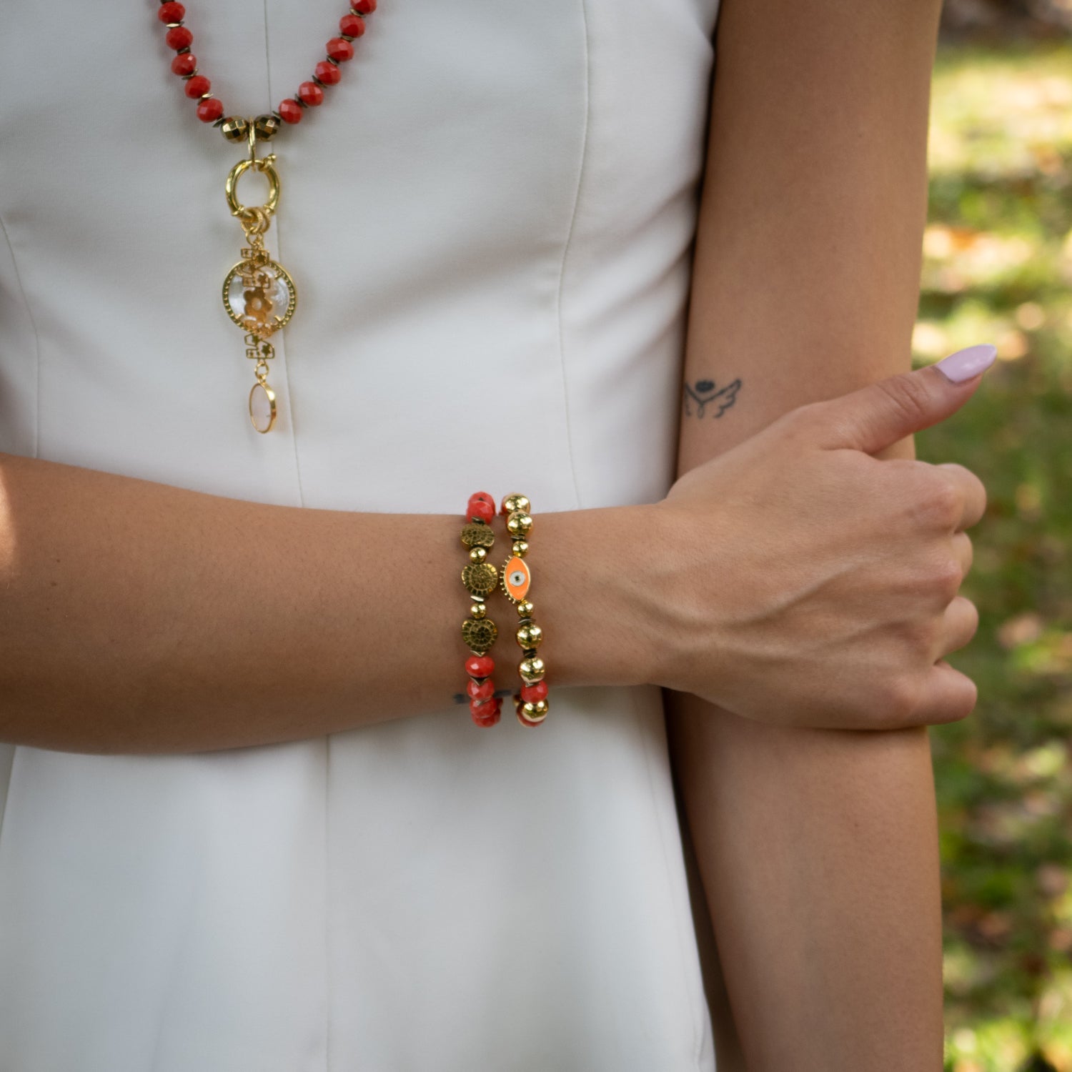 Vibrant orange and gold bracelet stack designed for spiritual protection and energy

