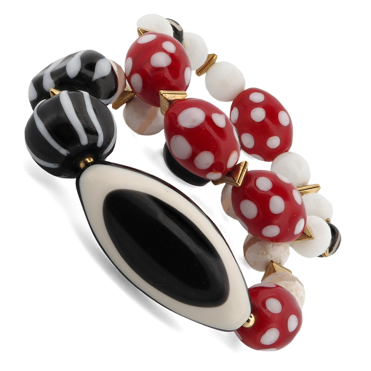Angled view of the Eye See You Agate Beaded Bracelet Set showing the black and white striped glass beads and gold hematite spacers