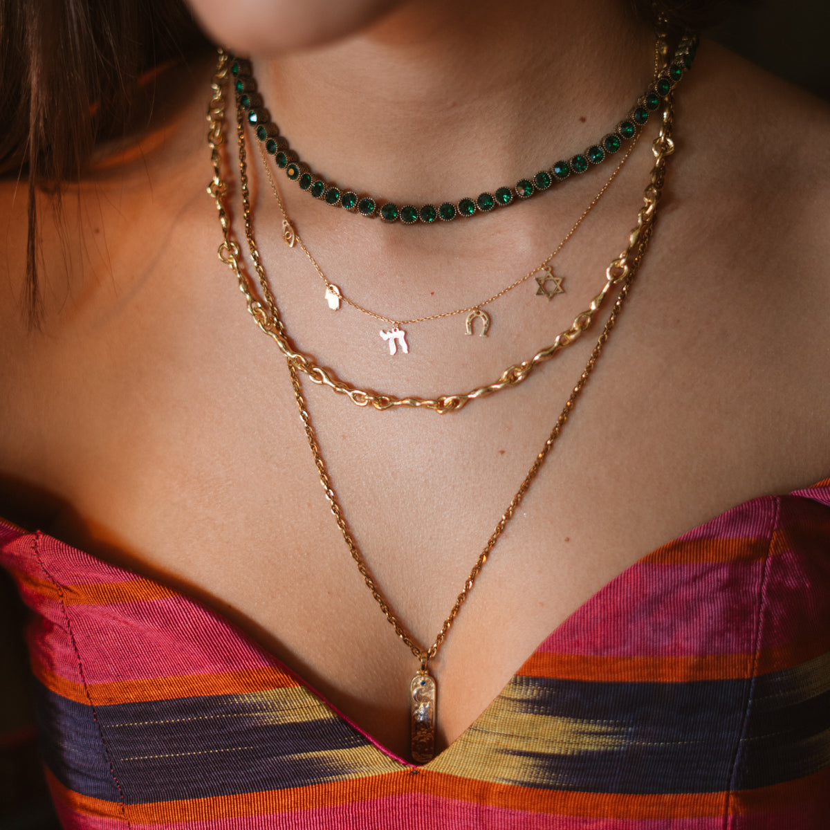 Five Guardians Star of David Protection Gold Charm Necklace layered with the Emerald Antique Gold Tennis Mystic Necklace and long gold chains