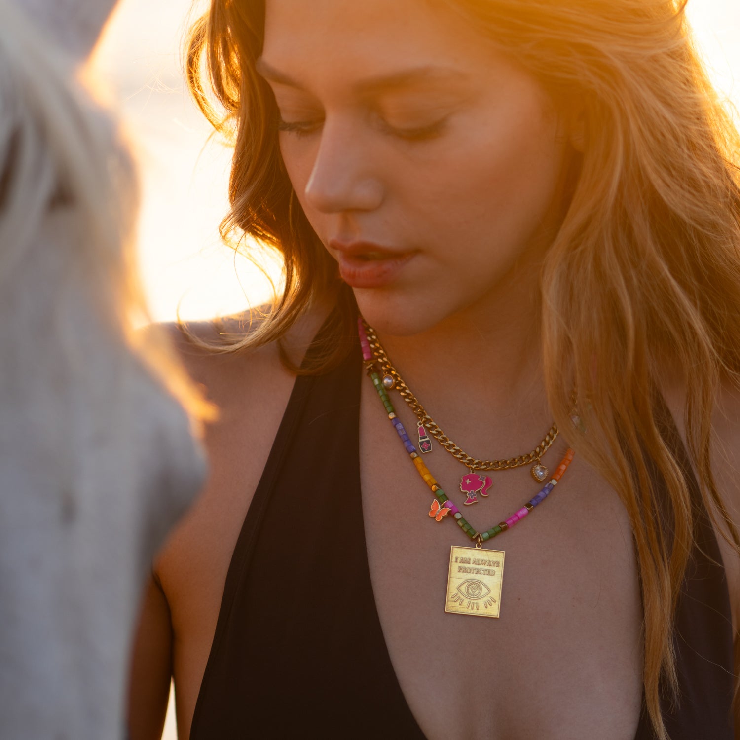 Glamour Girl necklace with colorful charms symbolizing beauty, style, and femininity