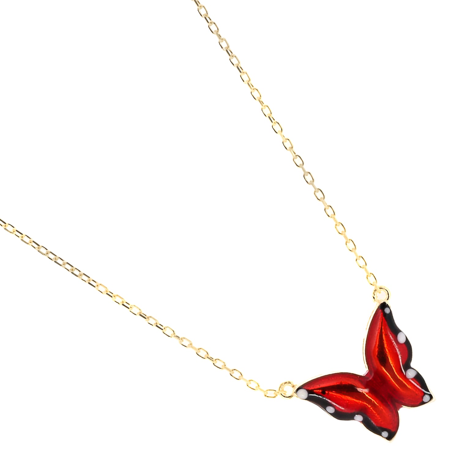 The captivating butterfly pendant of the Gold Joy Red Enamel Butterfly Necklace, symbolizing transformation and rebirth.