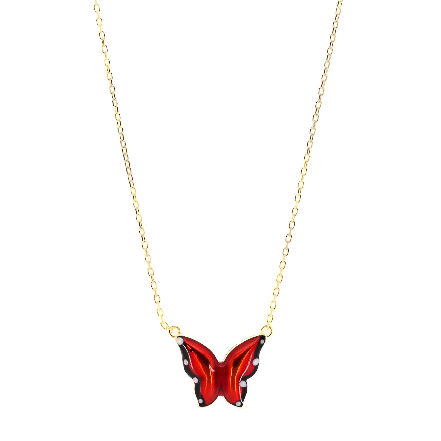 A close-up of the intricate red enamel design on the Gold Joy Butterfly Necklace.