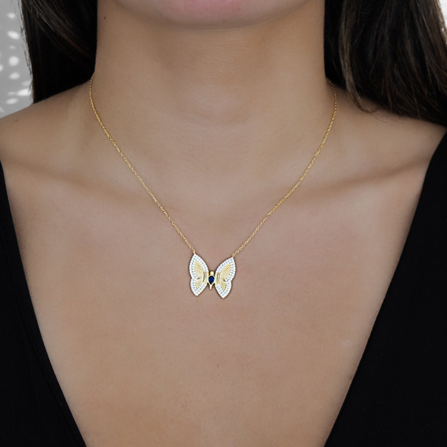 Model wearing the Gold Sparkly Hope Butterfly Necklace, radiating confidence and embracing the symbolism of hope and transformation.