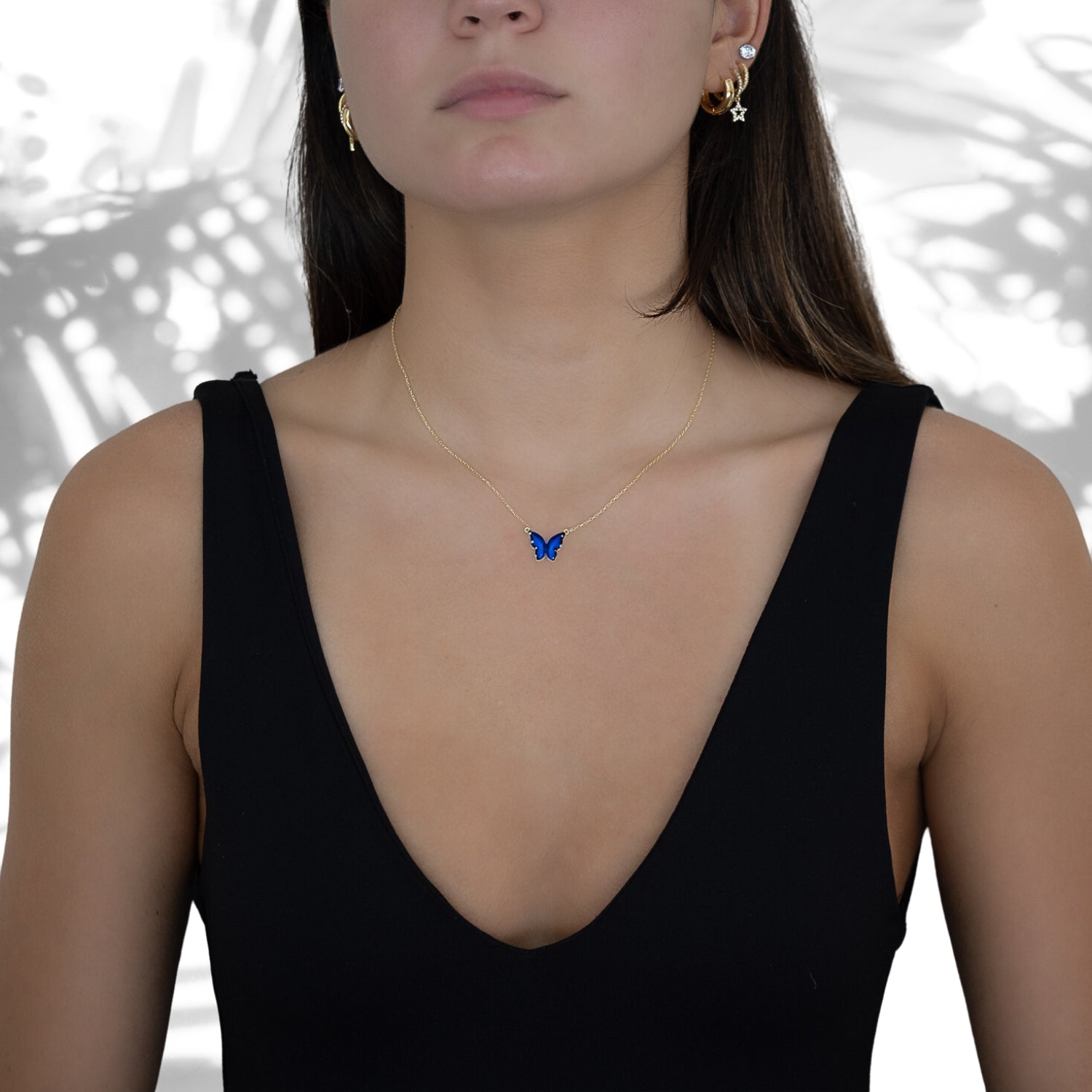Model wearing the Gold Spiritual Blue Enamel Butterfly Necklace, showcasing its unique design and the transformative energy it symbolizes.